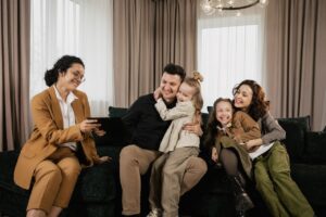 happy family goes over life insurance policy with their agent