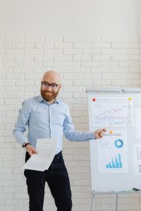 smiling financial advisor going over investment strategy